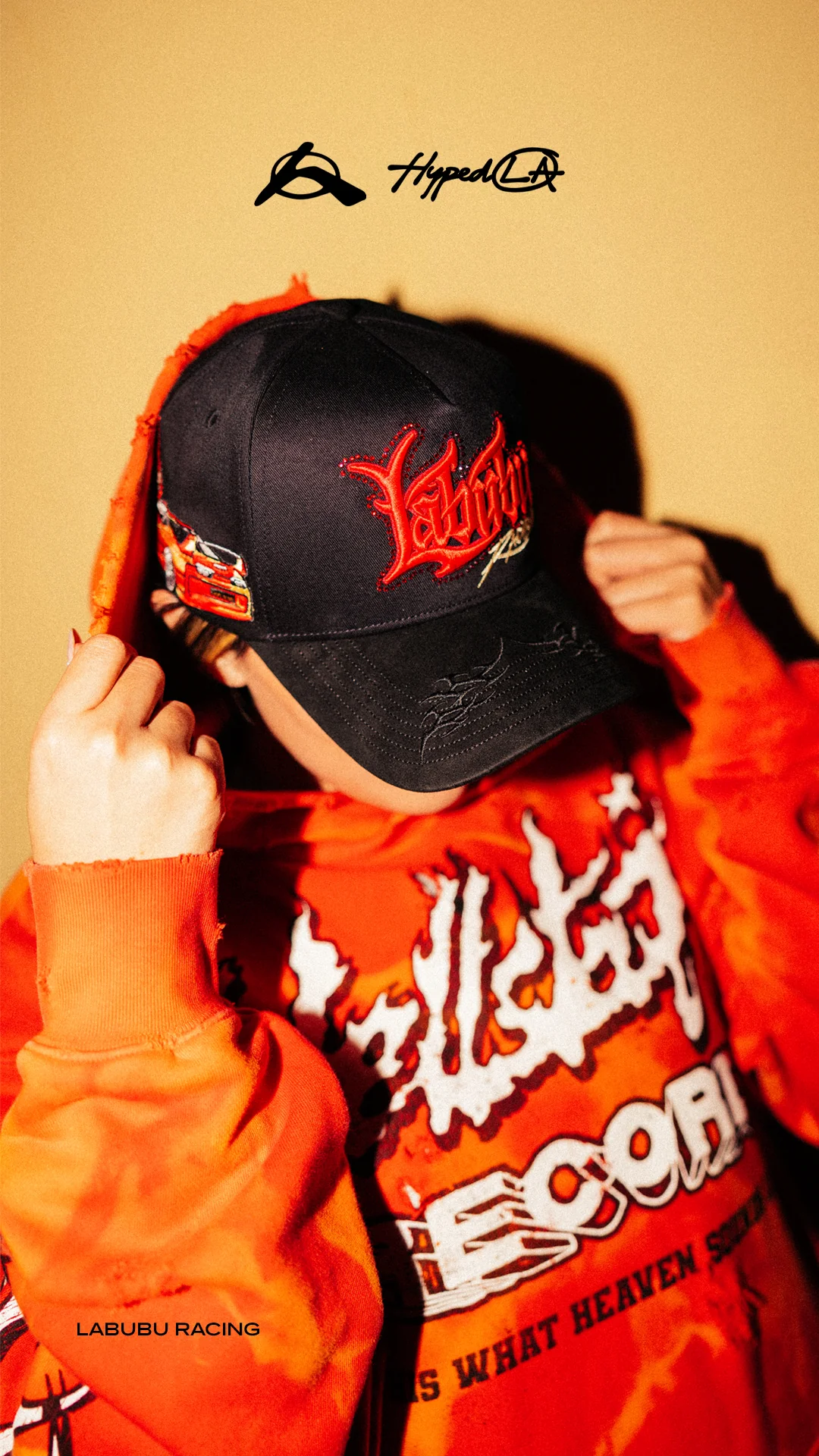 two women in suits standing beside wall