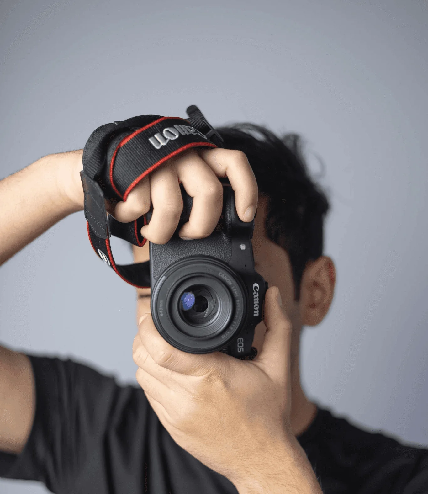 Black and white photo of man posing on camera