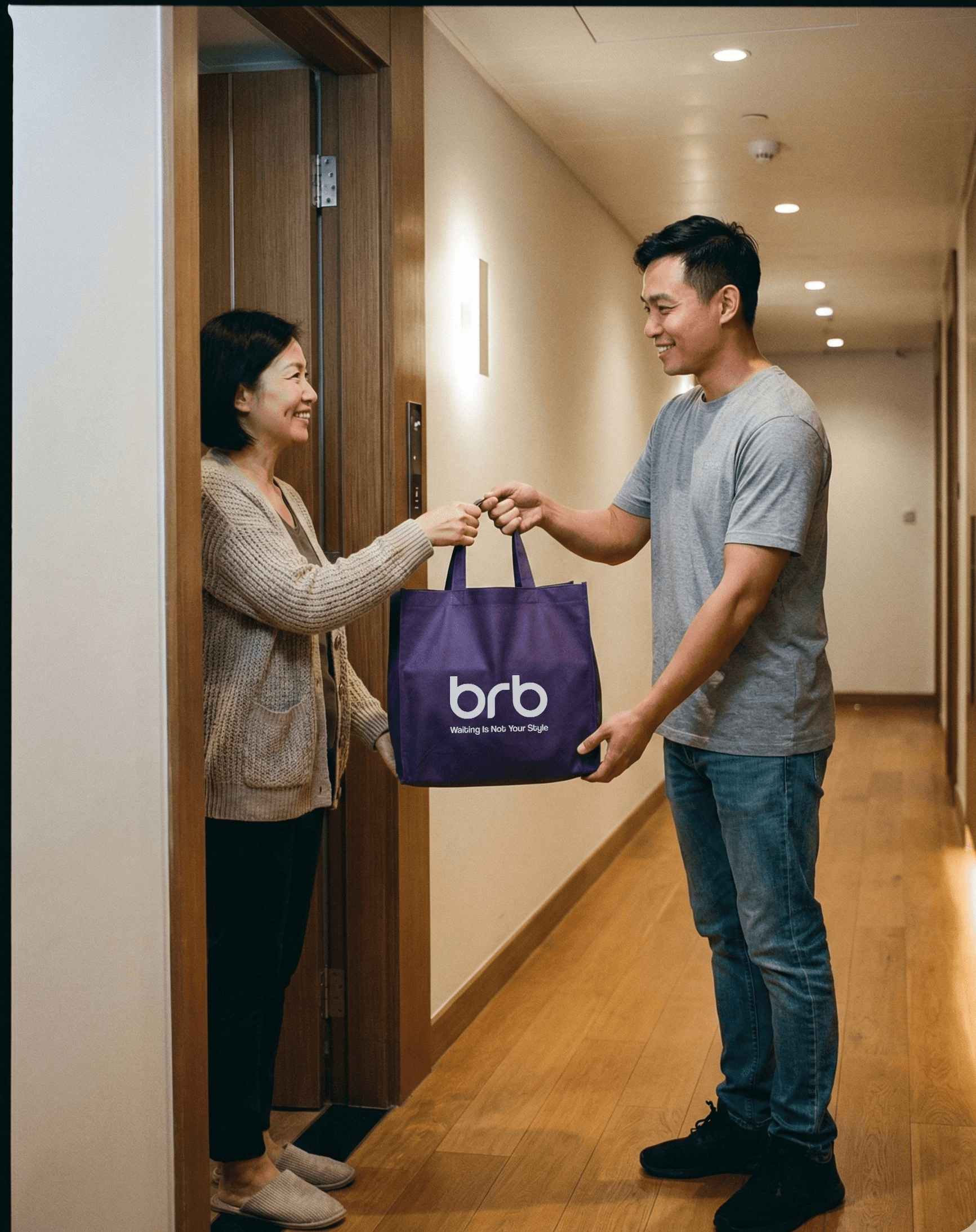 A rider handing a purple BRB bag to a smiling woman at the door of her apartment hallway