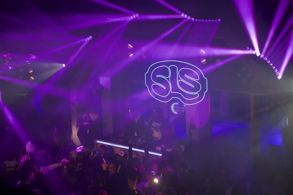 Stage Engage DJ event production for Soft Life Ski, featuring purple lighting, projected branding and a packed dance floor