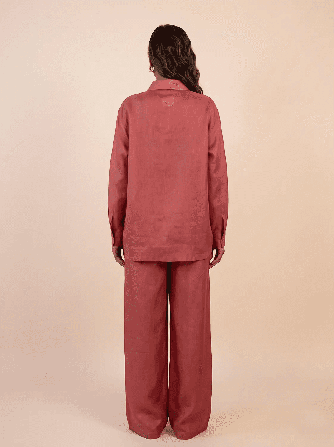 A relaxed co-ord set featuring a simple silk shirt, Designed for effortless wear