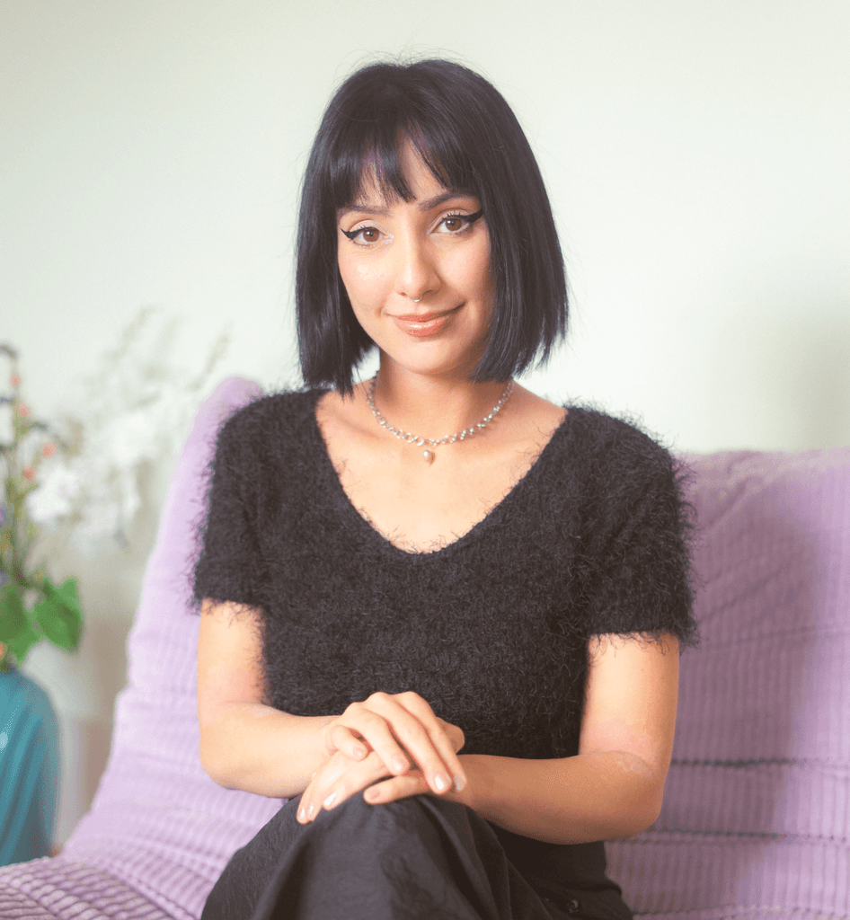 Visual designer in a minimalist studio with an iPad