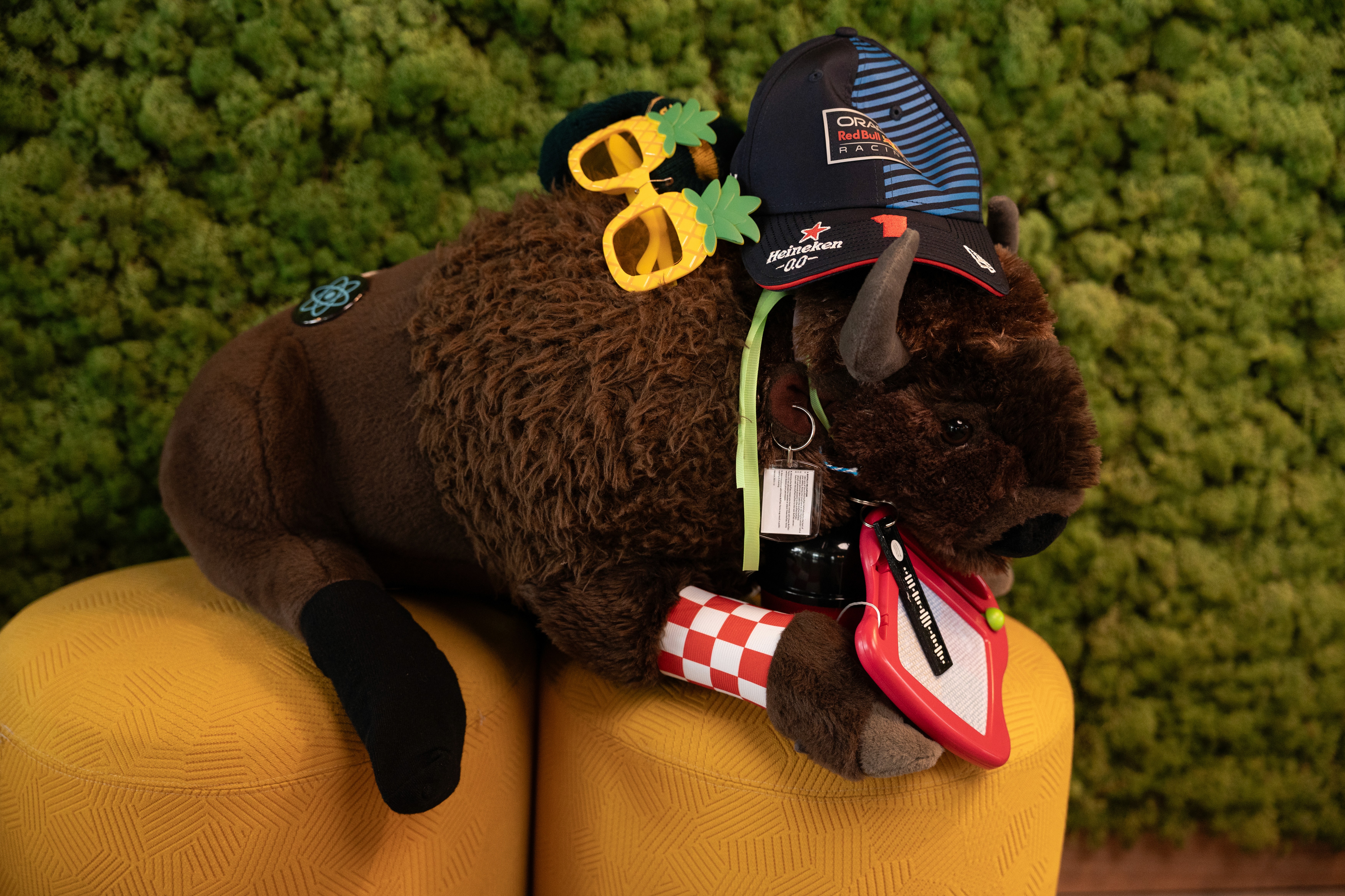 three people sitting in front of table laughing together