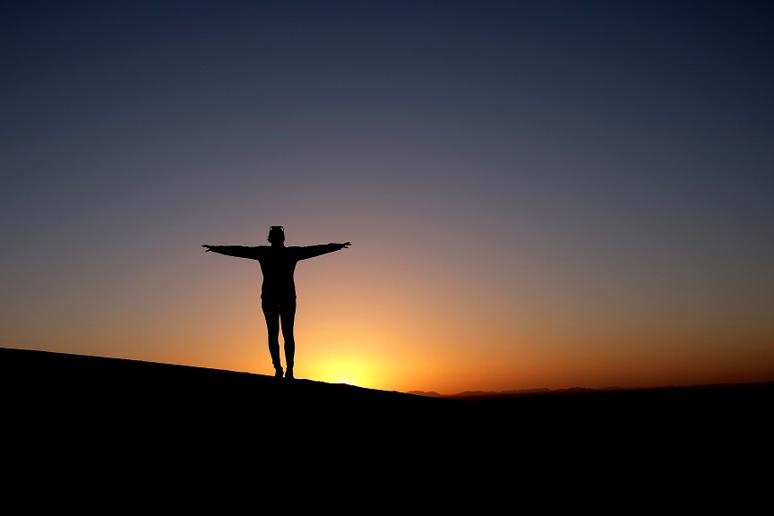Rows of traditional wooden balconies on a white building.