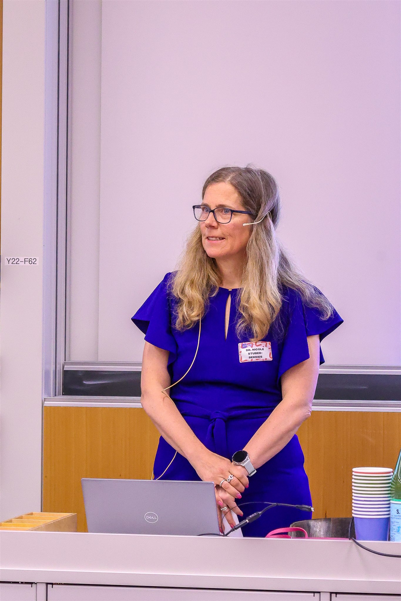 Conference speaker at podium during EthereumZüri event at University of Zurich