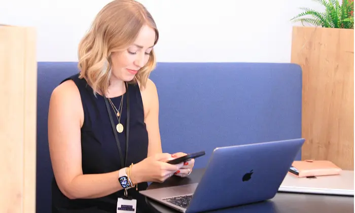 Abbie Ross working on a laptop