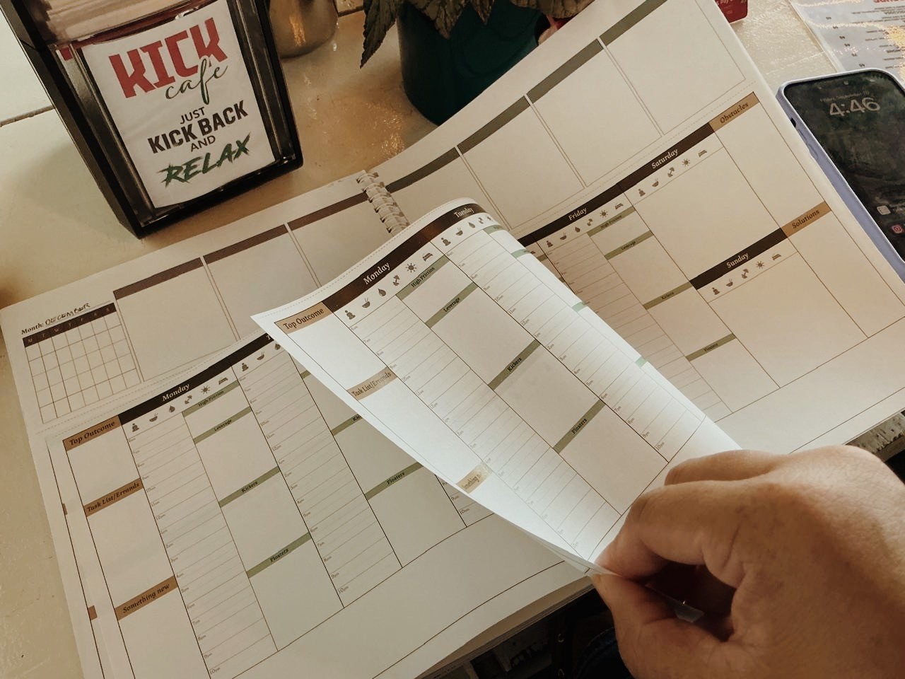 Table set for two with floral wallpaper background.