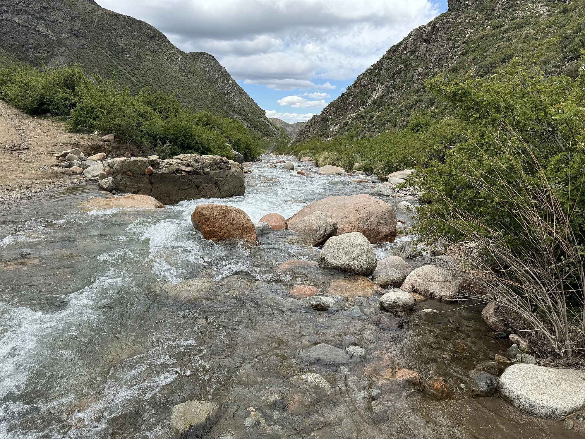 Rocky mountain stream flowing through the Andes, illustrating how alluvial soils formed in Argentina’s Uco Valley