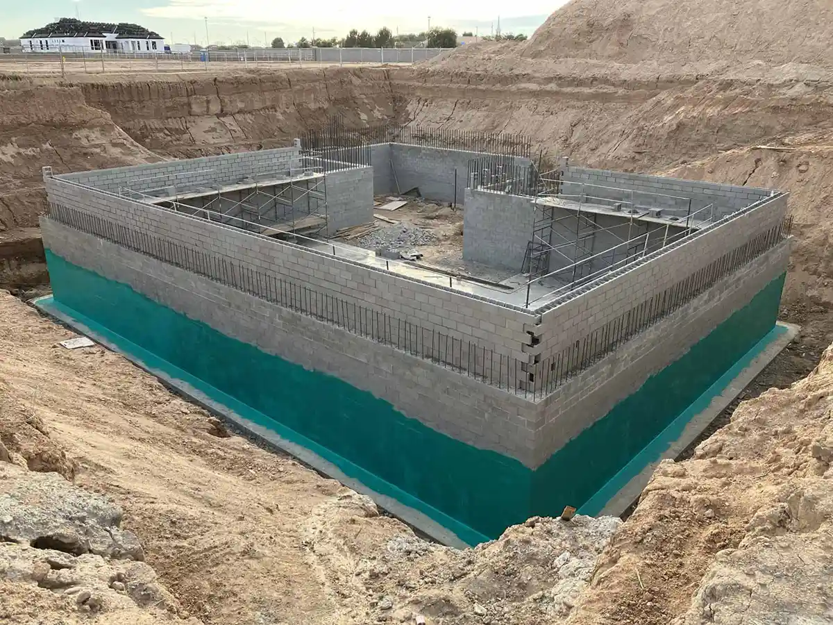 A photo of a commercial building on an ocean harbor with Rub-R-Wrap applied as an air barrier