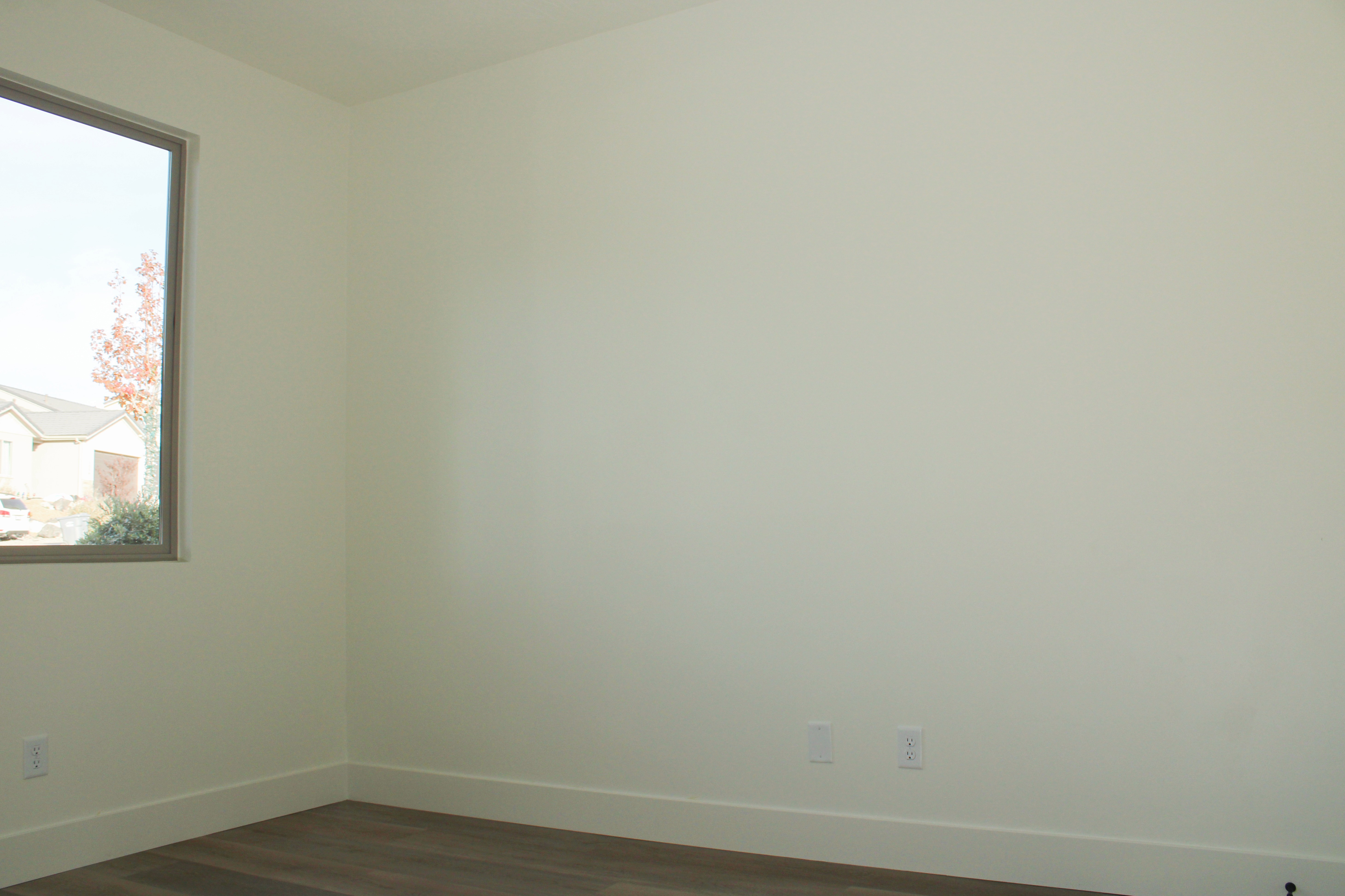 Bedroom inside the Golden Hour home in Hurricane, Utah with natural light and simple modern design.