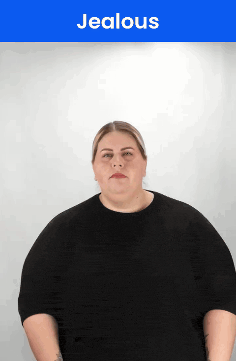 Animated GIF: a Deaf signer signs JEALOUS in ASL, a hooked index finger twisting at the corner of the mouth.