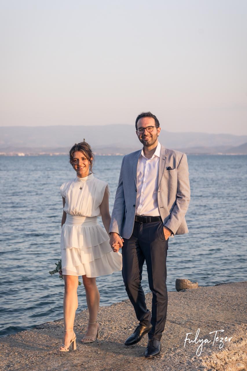 Couple portrait with dog on field