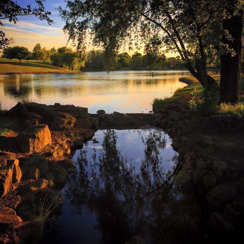 Photo taken at sunset over the lake with a small pond in the foreground