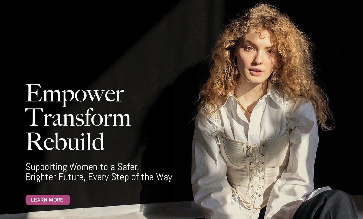 A snapshot of a website made for a charity that empowers women featuring Empower Transform Rebuild text and an image of a woman