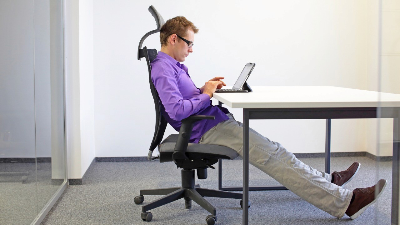 man sitting in office chair