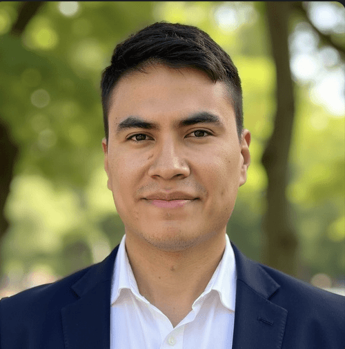 man in gray polo shirt smiling