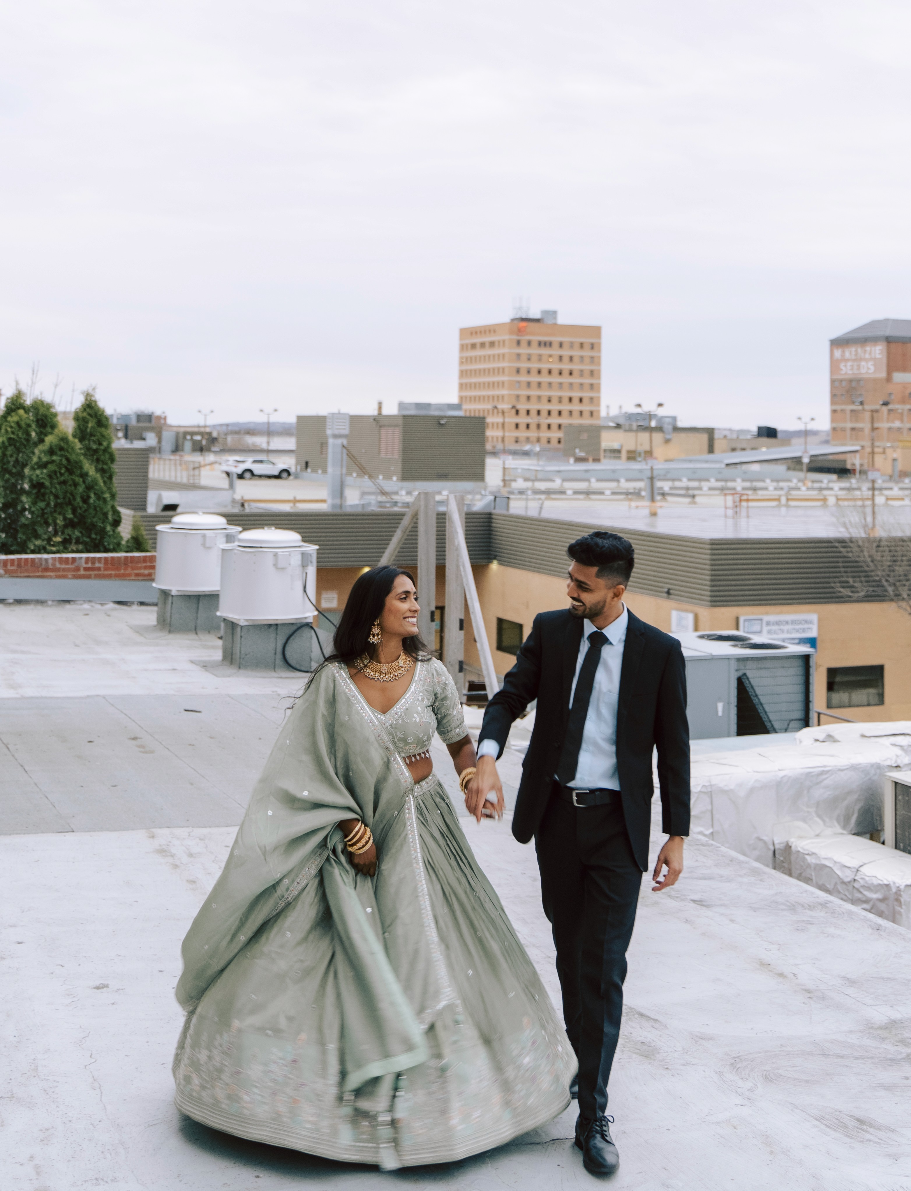 Wedding Brandon couple walking hand in hand Manitoba Winnipeg celebration