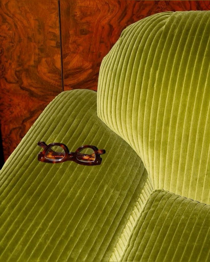green couch with eyeglasses
