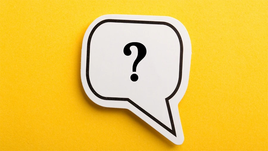 A sticker of a question mark on a yellow background.