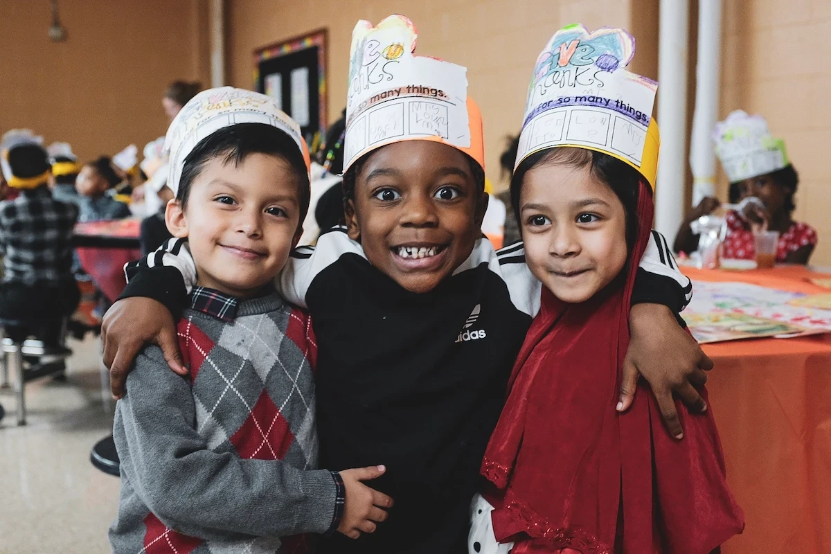 Elementary students at Buffalo Academy of Science sharing smiles during a social-emotional learning activity