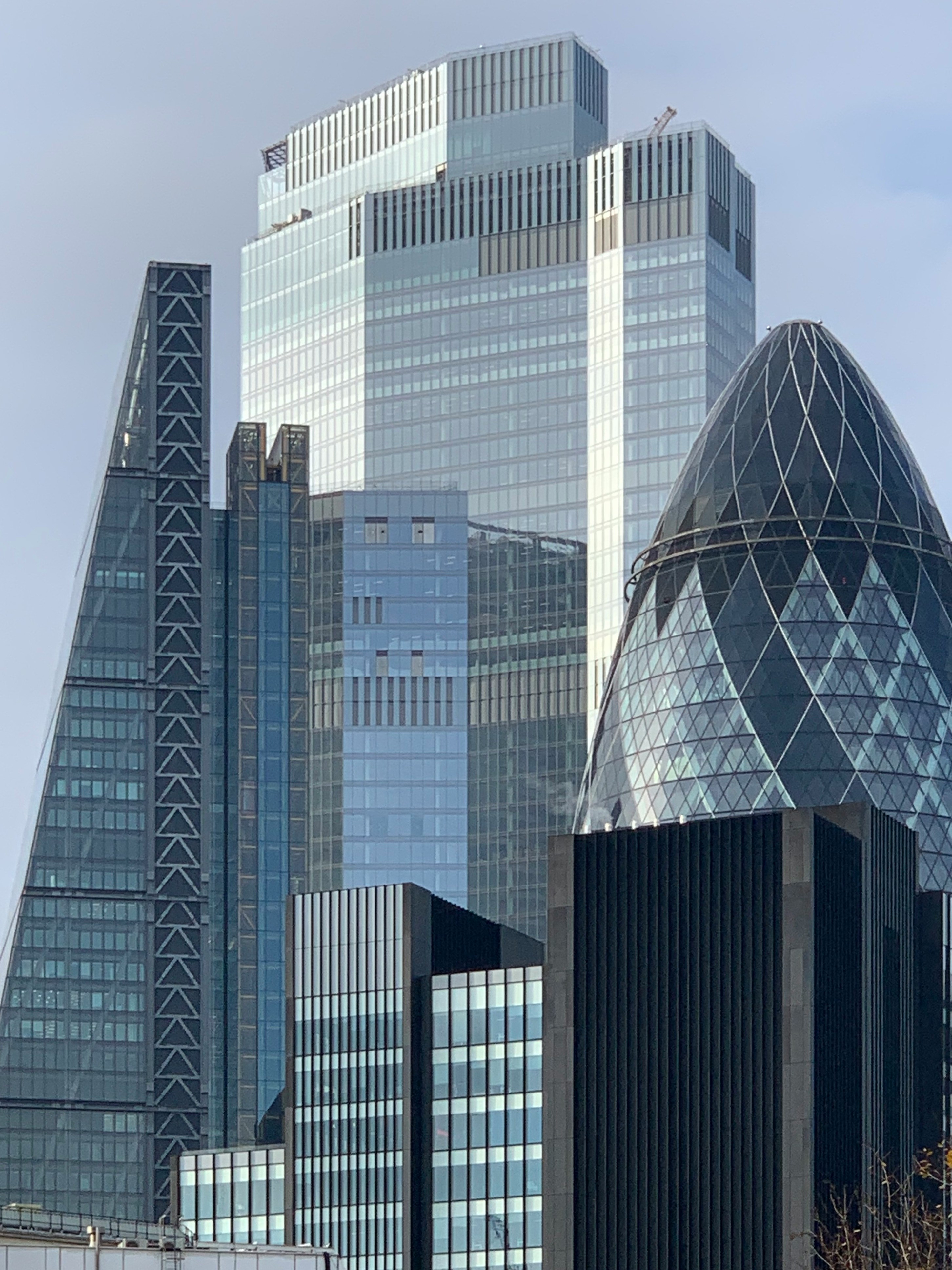white and blue glass walled high rise building