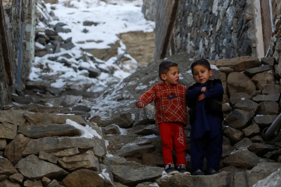 afghan kids standing in snow