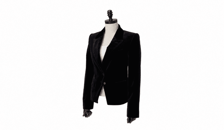 Structured black velvet blazer with tailored shoulders displayed on a mannequin for evening outfits