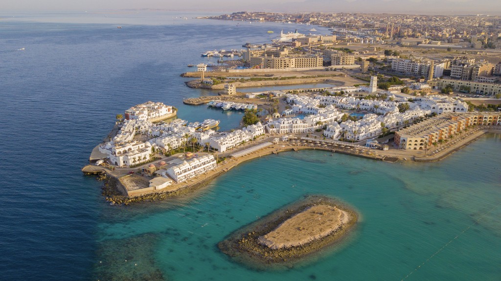 a view of a beach and some buildings