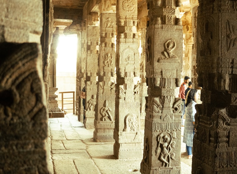 A pillared temple hall in warm daylight