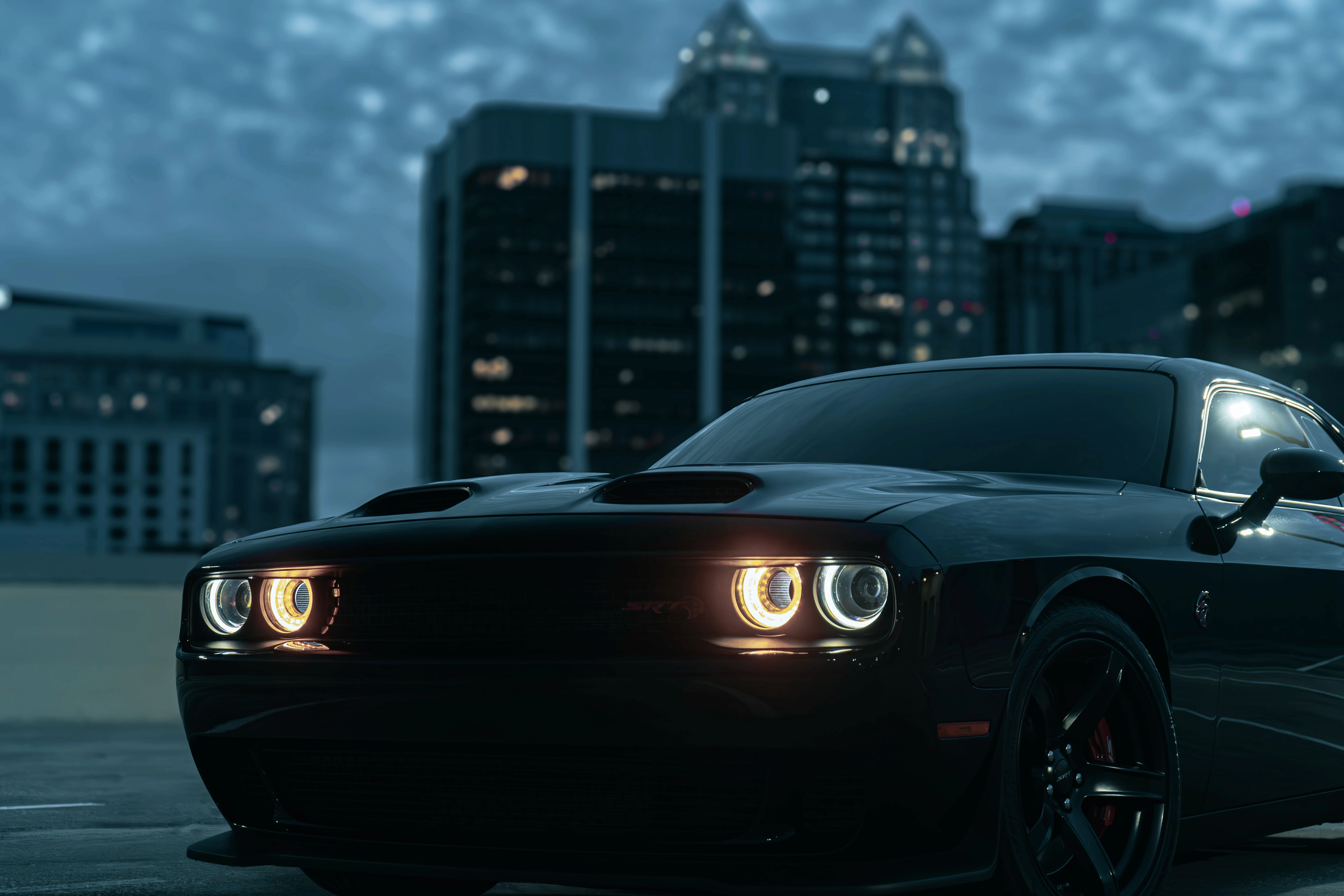 A cheerful car renter talking to an excited young child ready to drive a sportscar, ideal for car rental family moments.