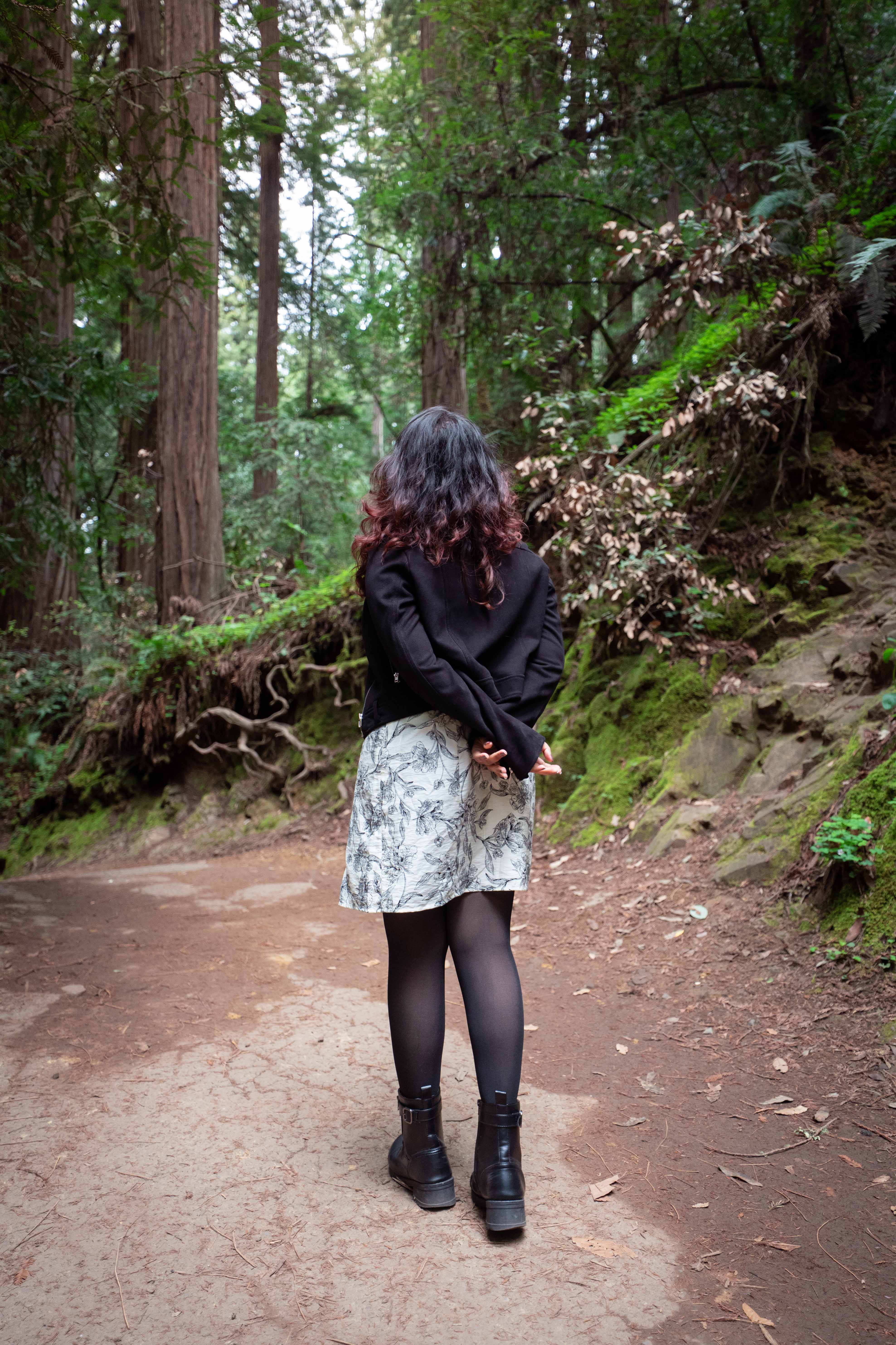 a blurry photo of a person standing in front of a wall