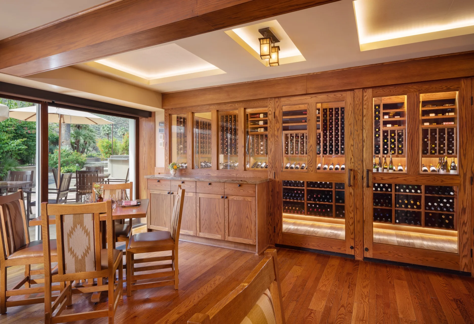 nfinity pool blending into the ocean view, minimalist sun loungers in soft neutral fabric, curved architecture