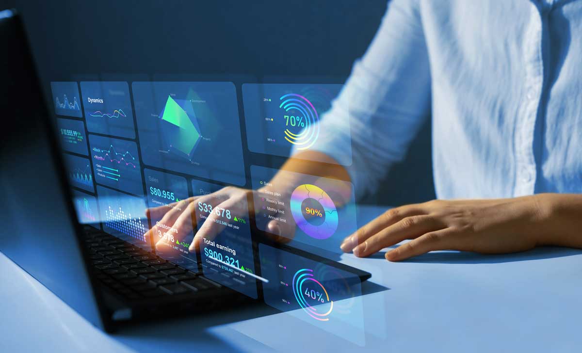 A person walks in front of large stone arches with dark doors, flanked by tall columns, in a historic building.