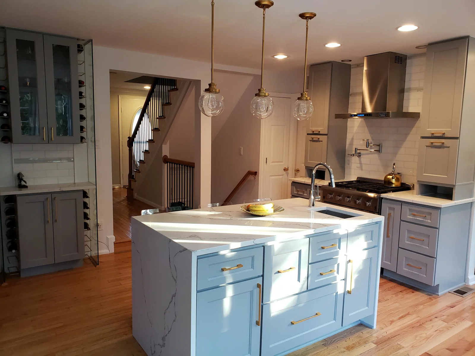 Brooklyn Gray kitchen with an island and a wine cabinet