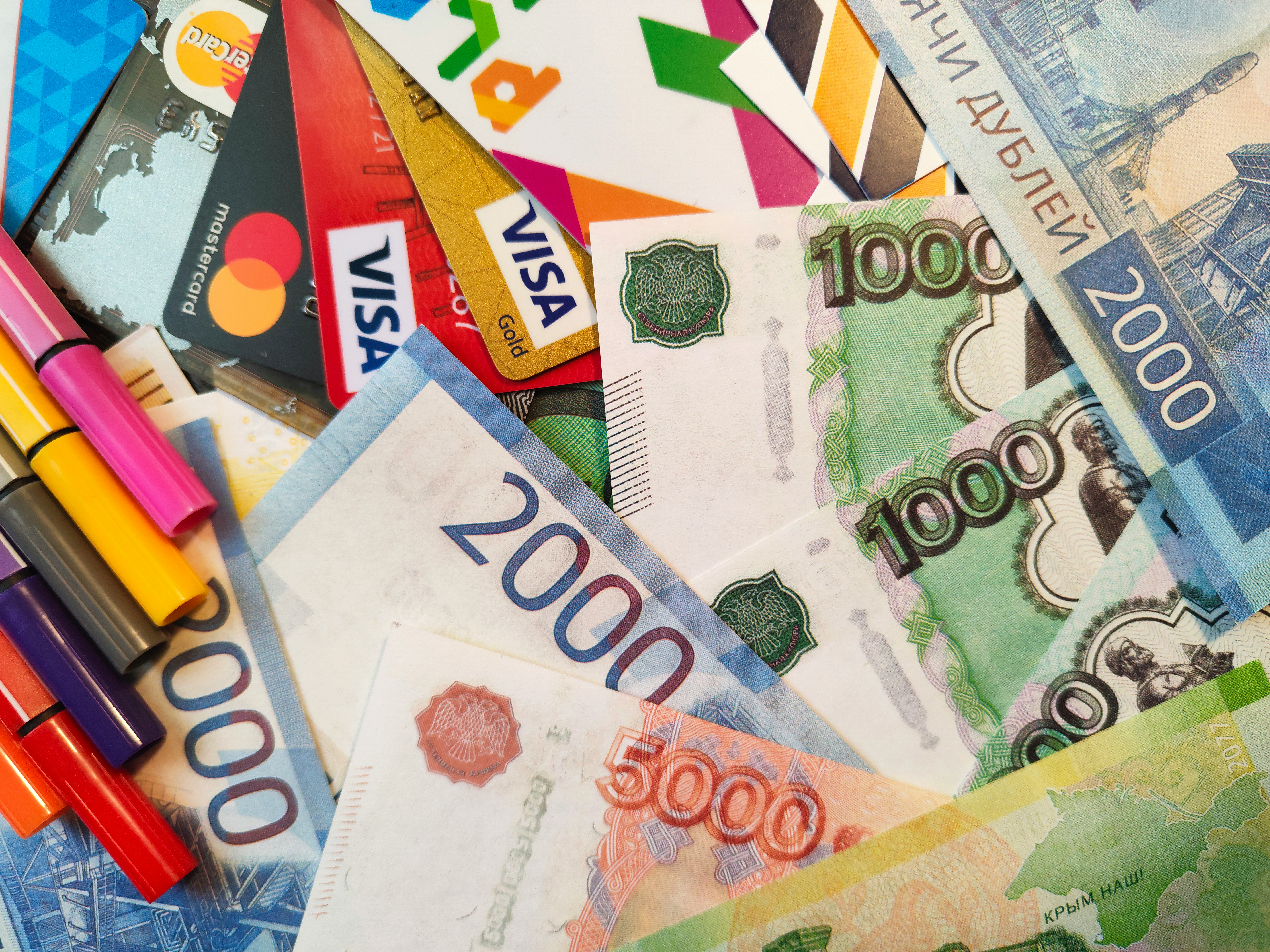 A pile of money with markers on it