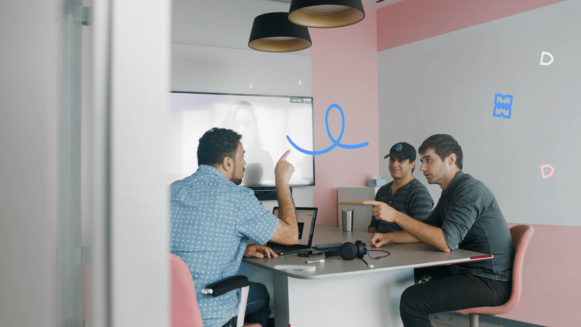 Team meeting in modern office with creative motion graphics showing collaboration and discussion
