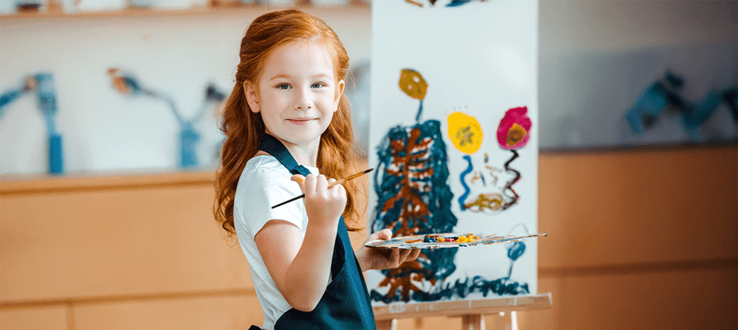 Elementary students creating artwork in structured drawing and painting after school enrichment program