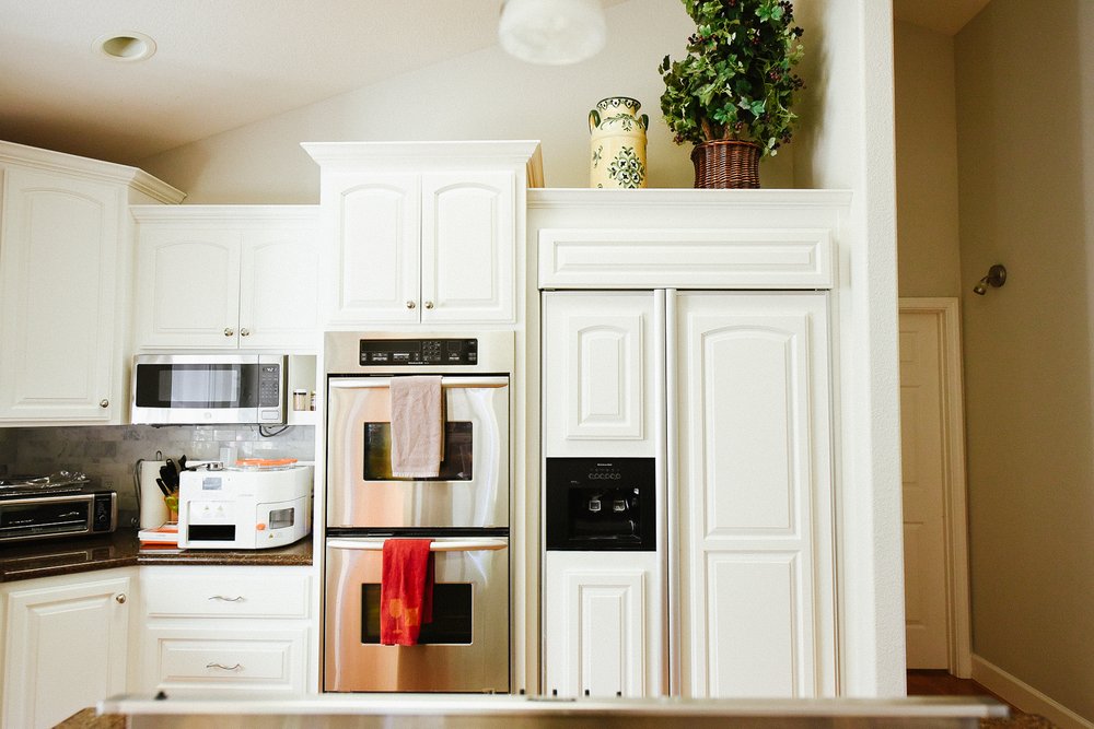 husband and wife working happily on a laptop