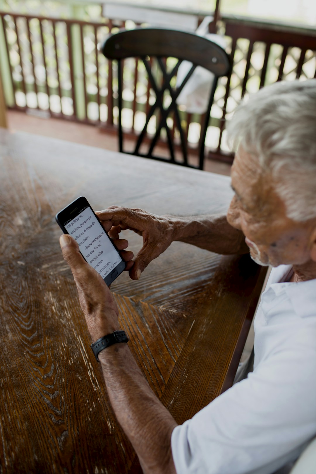 caregiver checking smartphone alert notification