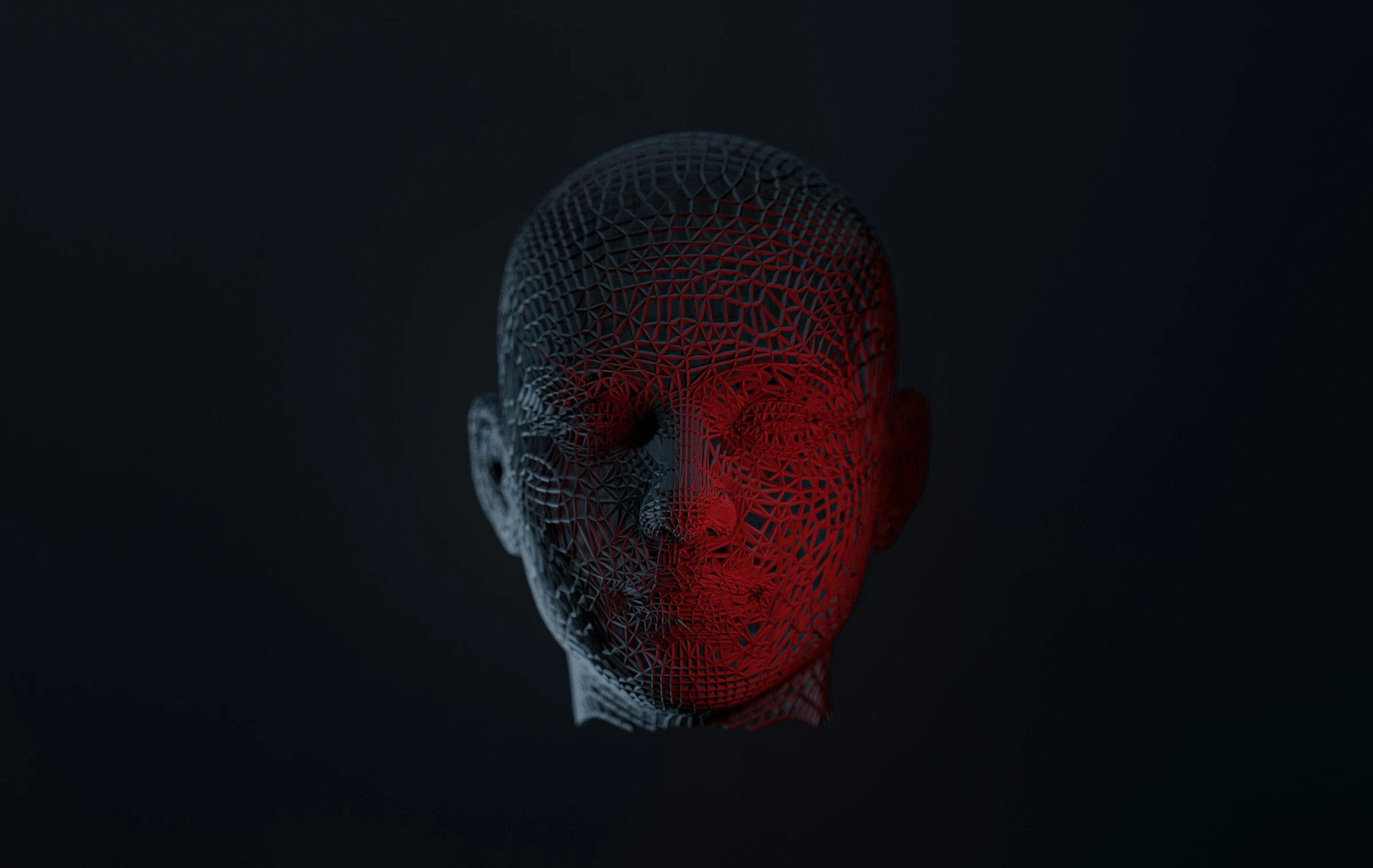 3D wireframe human head half-lit in red, representing artificial intelligence