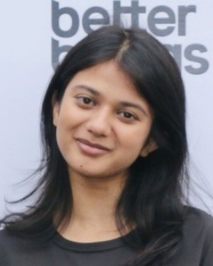 man in gray crew neck t-shirt and gray shorts sitting on basketball court