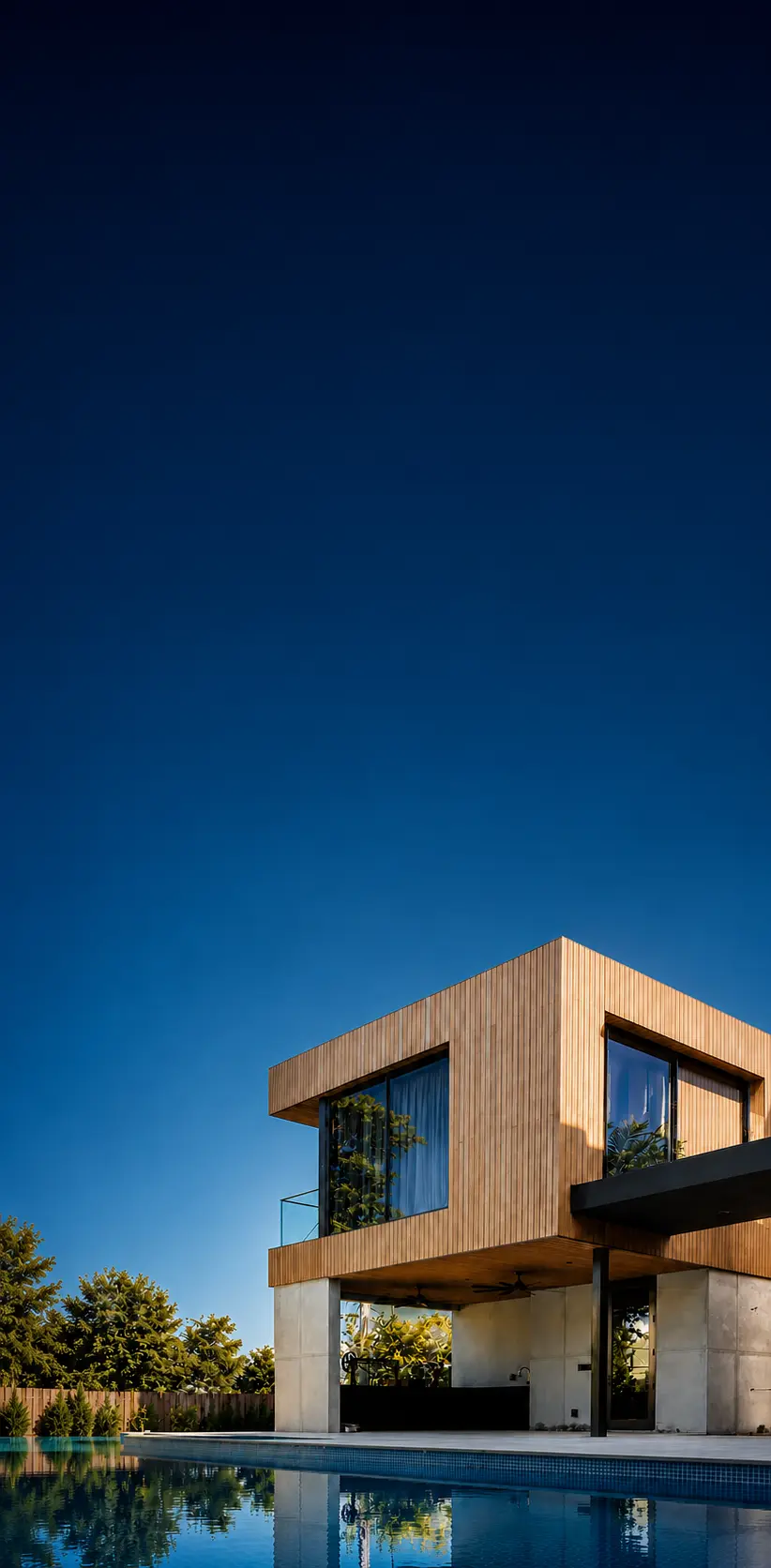 Contemporary Miami residence with infinity pool, wood-clad cantilevered upper level, and indoor-outdoor living designed by Atelier International.