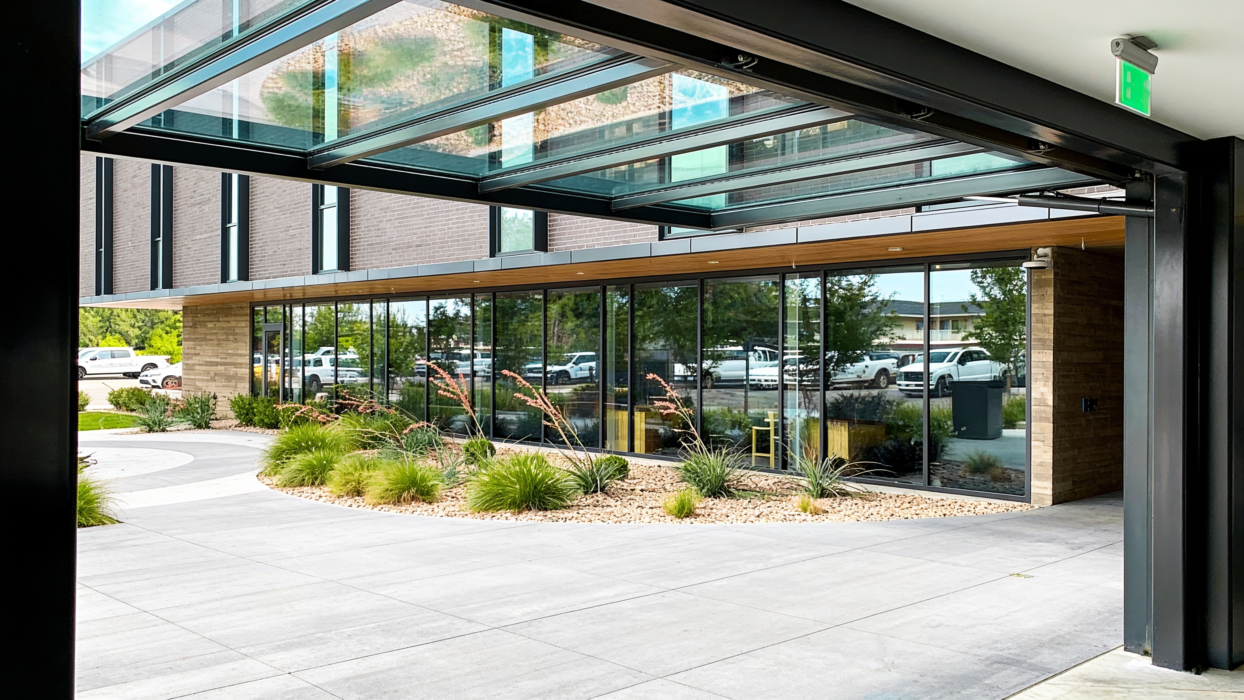 All-welded steel concealed cylinder glass door on a commercial building