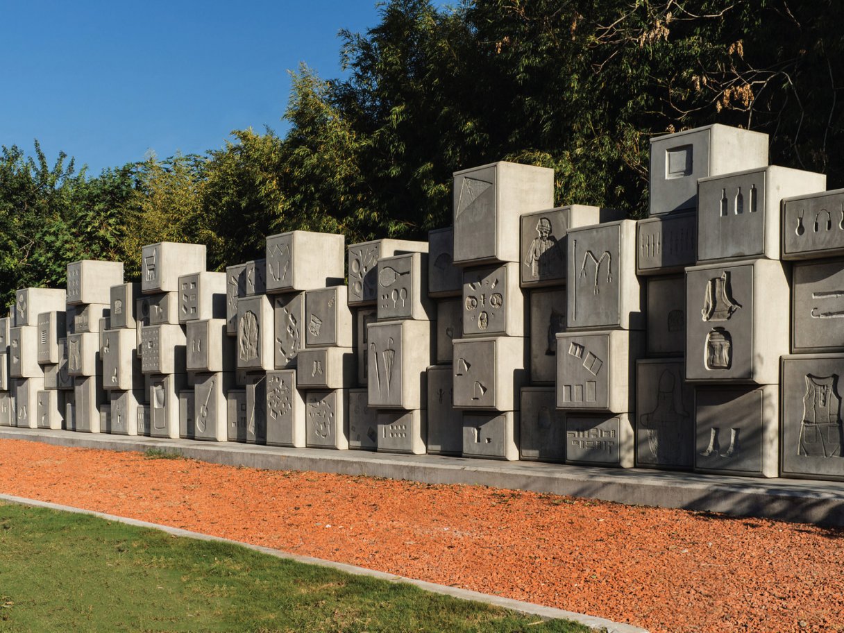 Rooftops of a coastal town with the sea in background