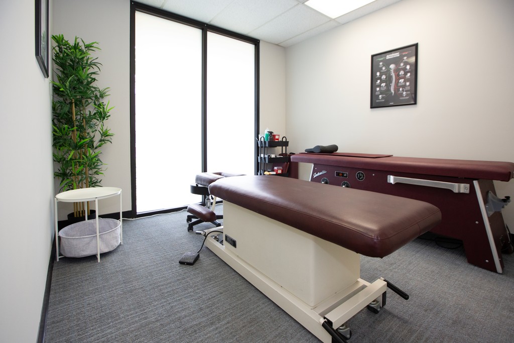 man in blue button up shirt lying on white bed