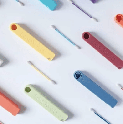 person holding black ipad with green plant