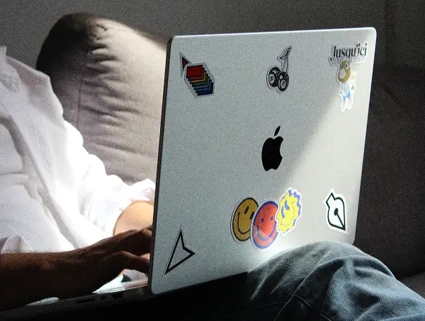 Close-up of Karim working on laptop, focusing on digital design workflow.