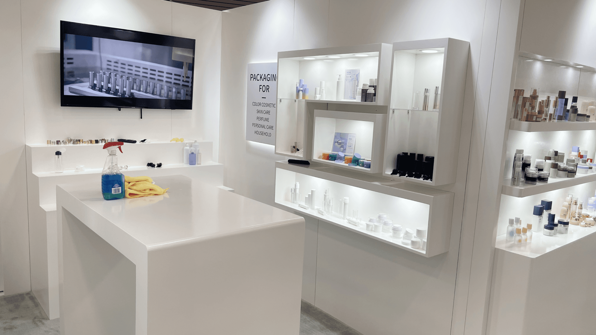 Island trade show booth with furniture-style presentation layout engineered for hotel interior and FF&E brands