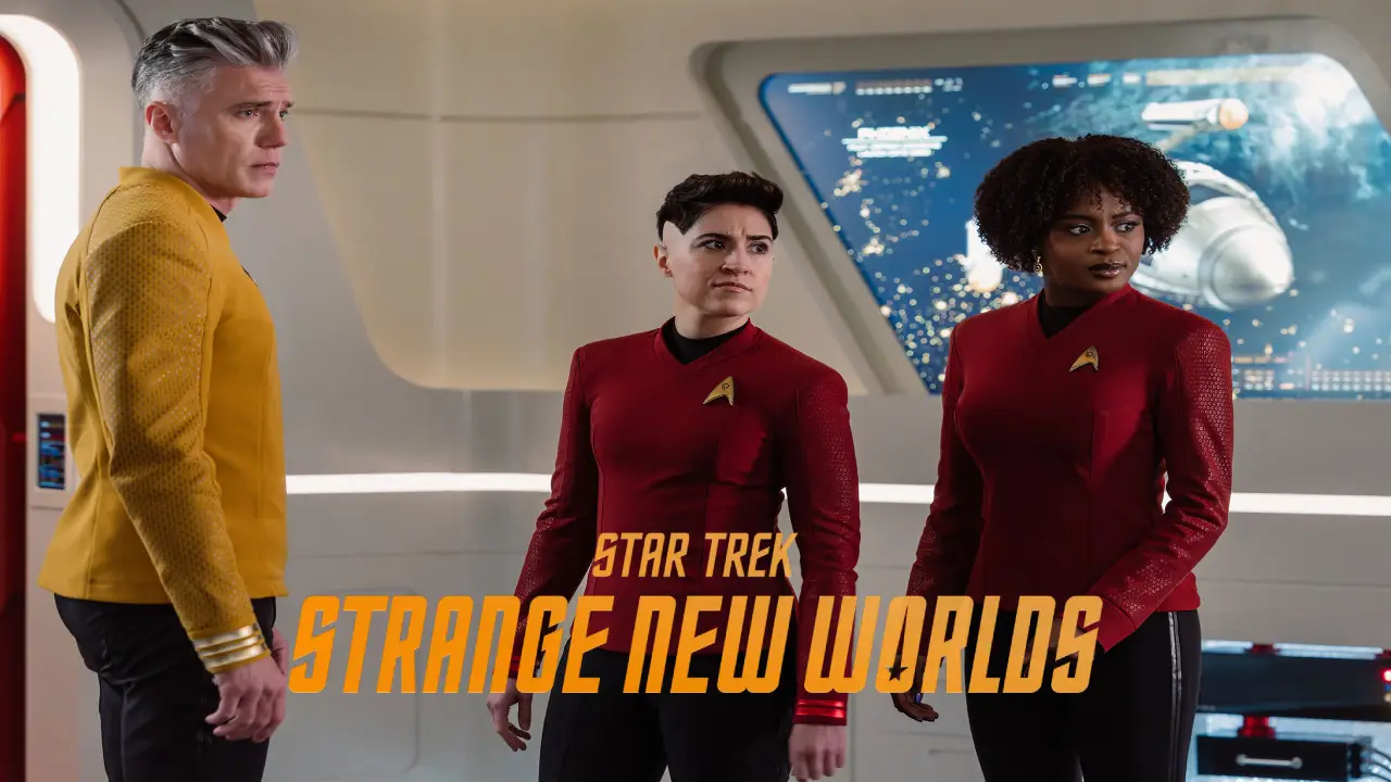 A group of three Starfleet officers in colourful uniforms stand in a futuristic spaceship bridge, with high-tech displays and controls visible in the background, from the series "Star Trek: Strange New Worlds."