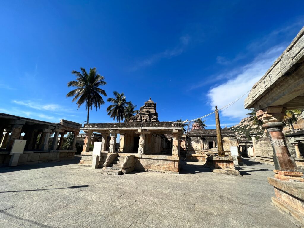 The ancient temple of Ramalingeshwara in Avani. The dhwaja stambh or the flag pole is also seen along the numerous structures next to the betta.